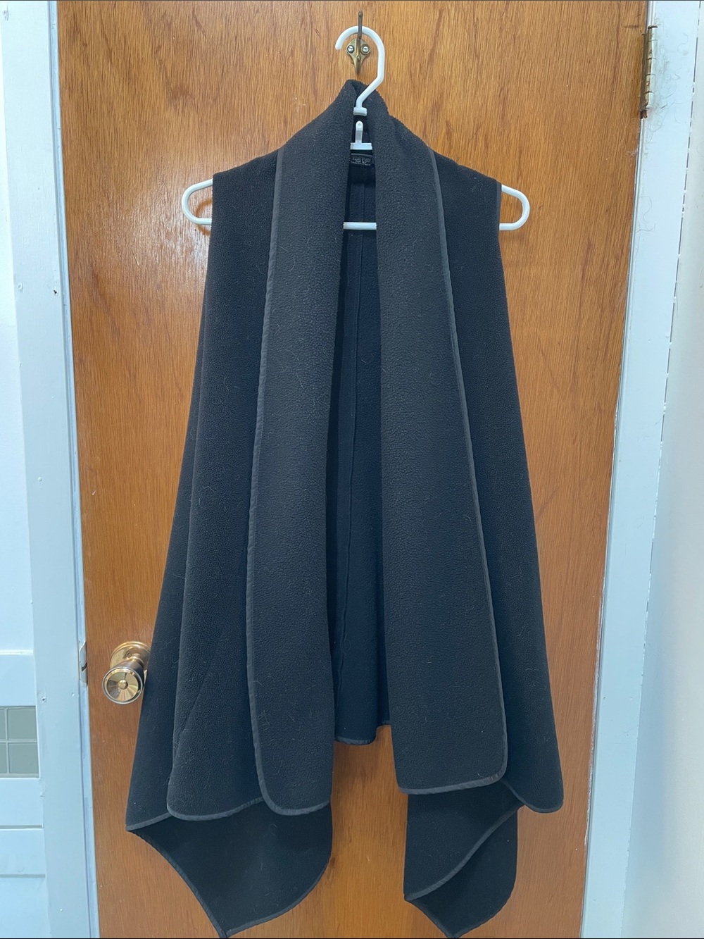 Black sleeveless Swing Vest with front pockets